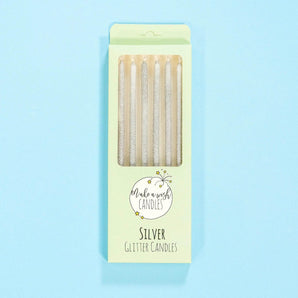 Crumbs & Doilies Silver Glitter Candles six sparkly silver birthday candles in pastel packaging.